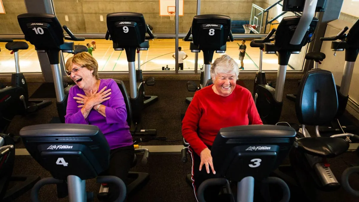 Two senior female members exercising a Vancouver YMCA gym