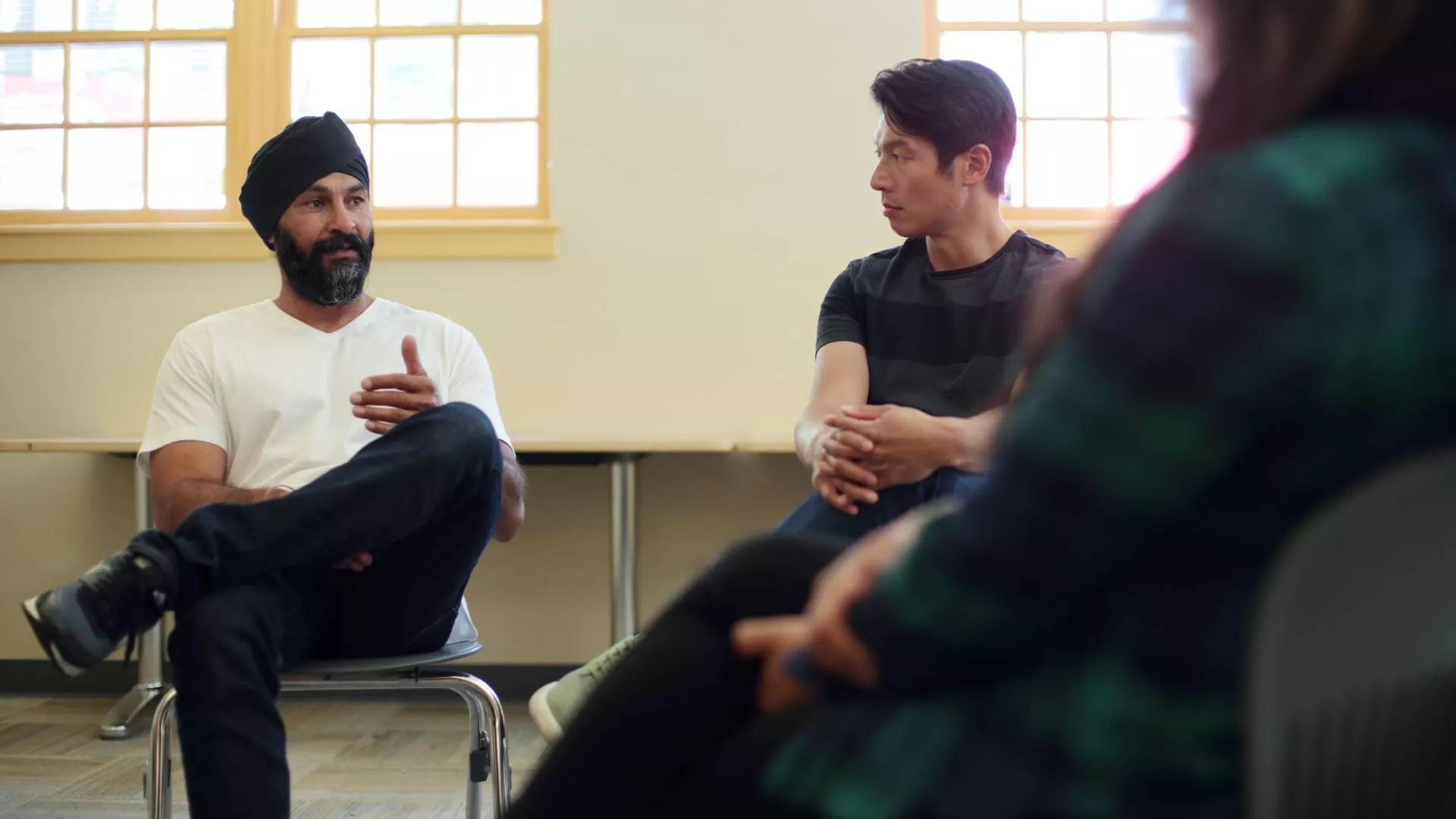 Male participant talking in free YMCA mental wellness program